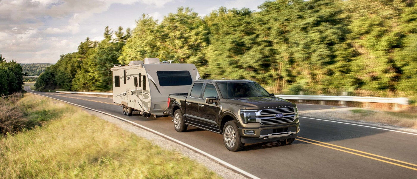 2024 Ford F-150 exterior on highway towing an RV