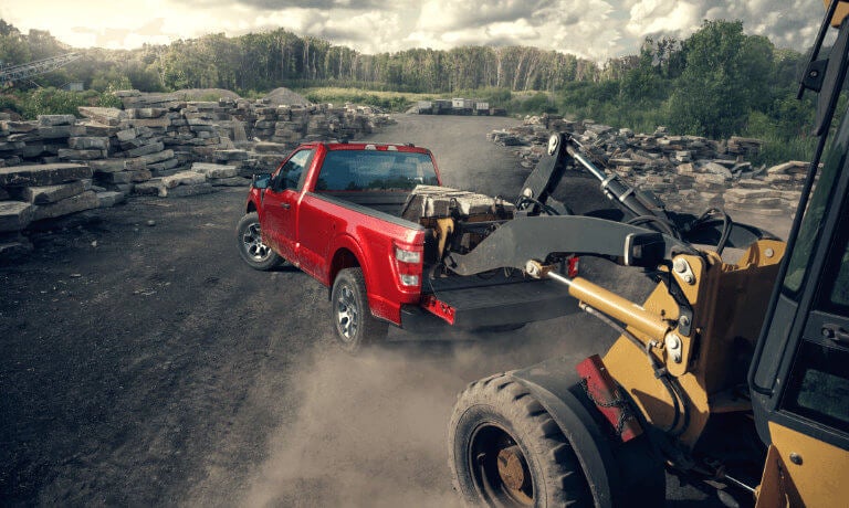 2023 Ford F-150 exterior loading cargo at construction site